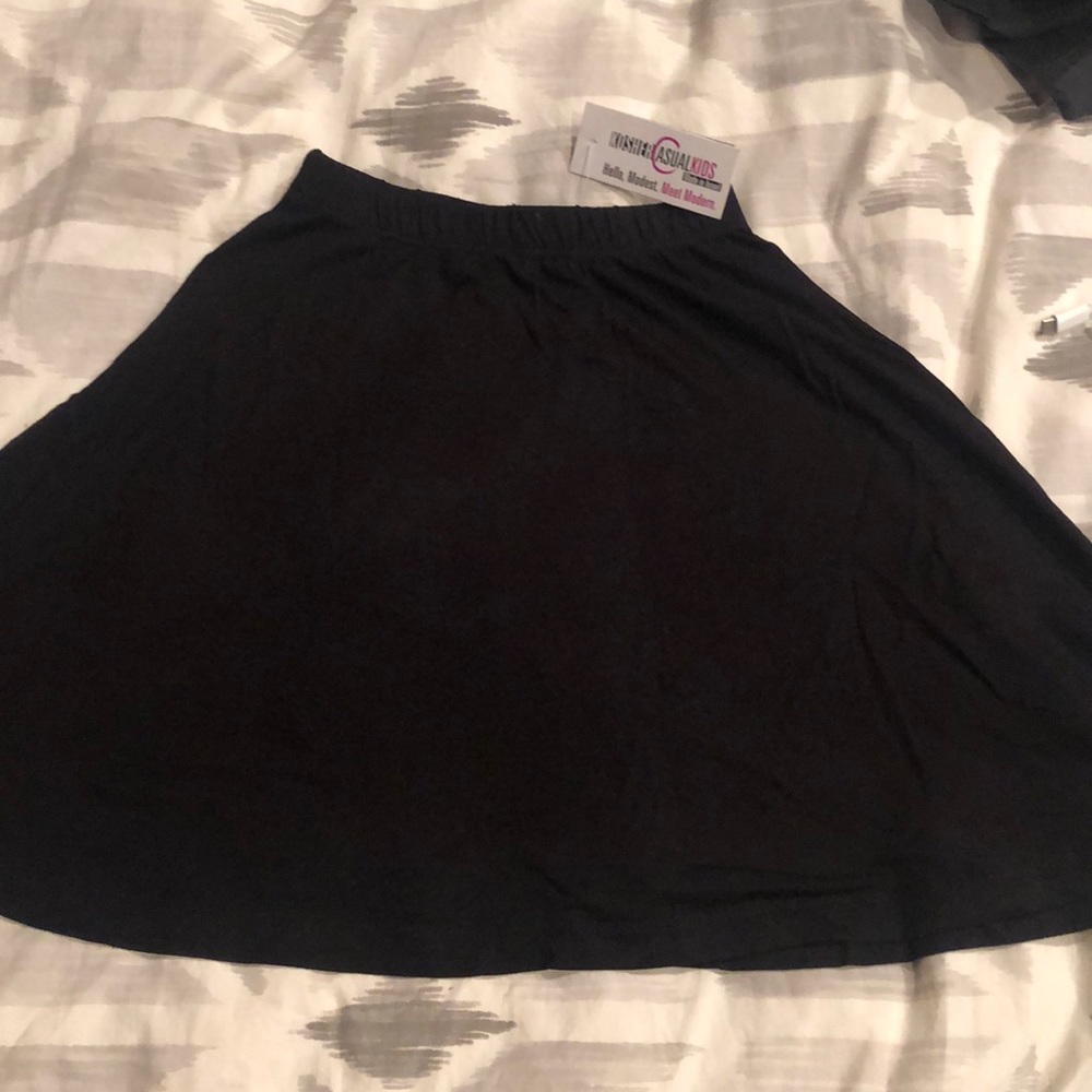 Black size extra small skater skirt with A line cut. Modest cut